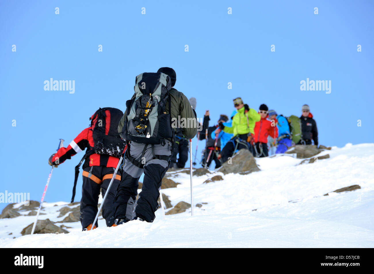 Climbing groups ascending and decending Cima del Similaun in the Otztal Alps in Austria. Stock Photo