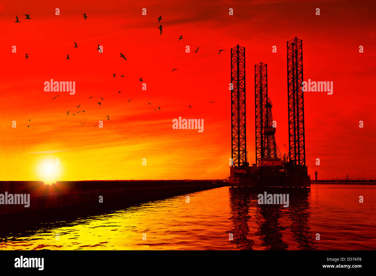 Oil drilling rig in sunset time. Stock Photo