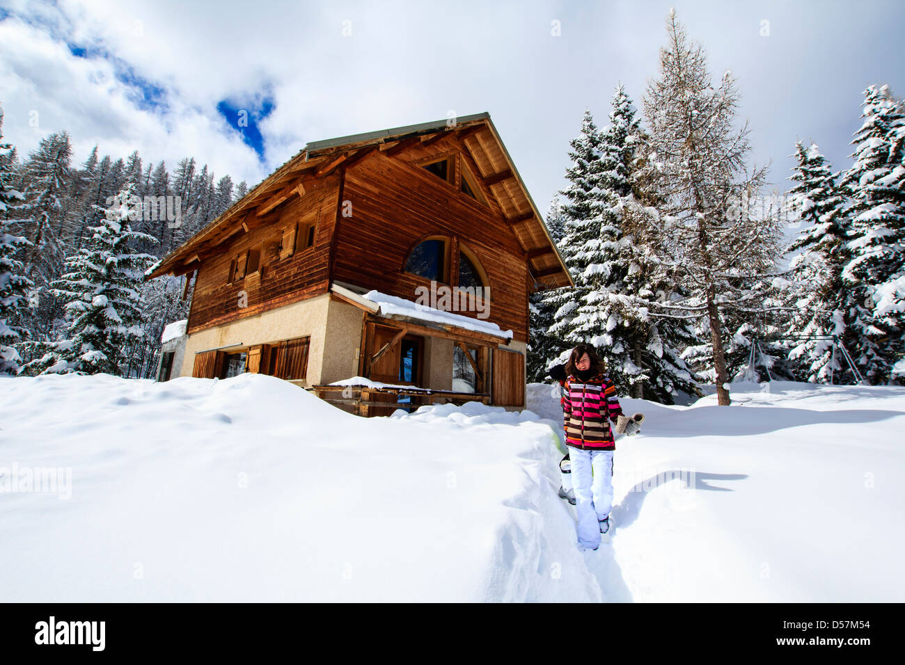 Girl In Ski Costume Walking Out Of Winter Ski Chalet In French