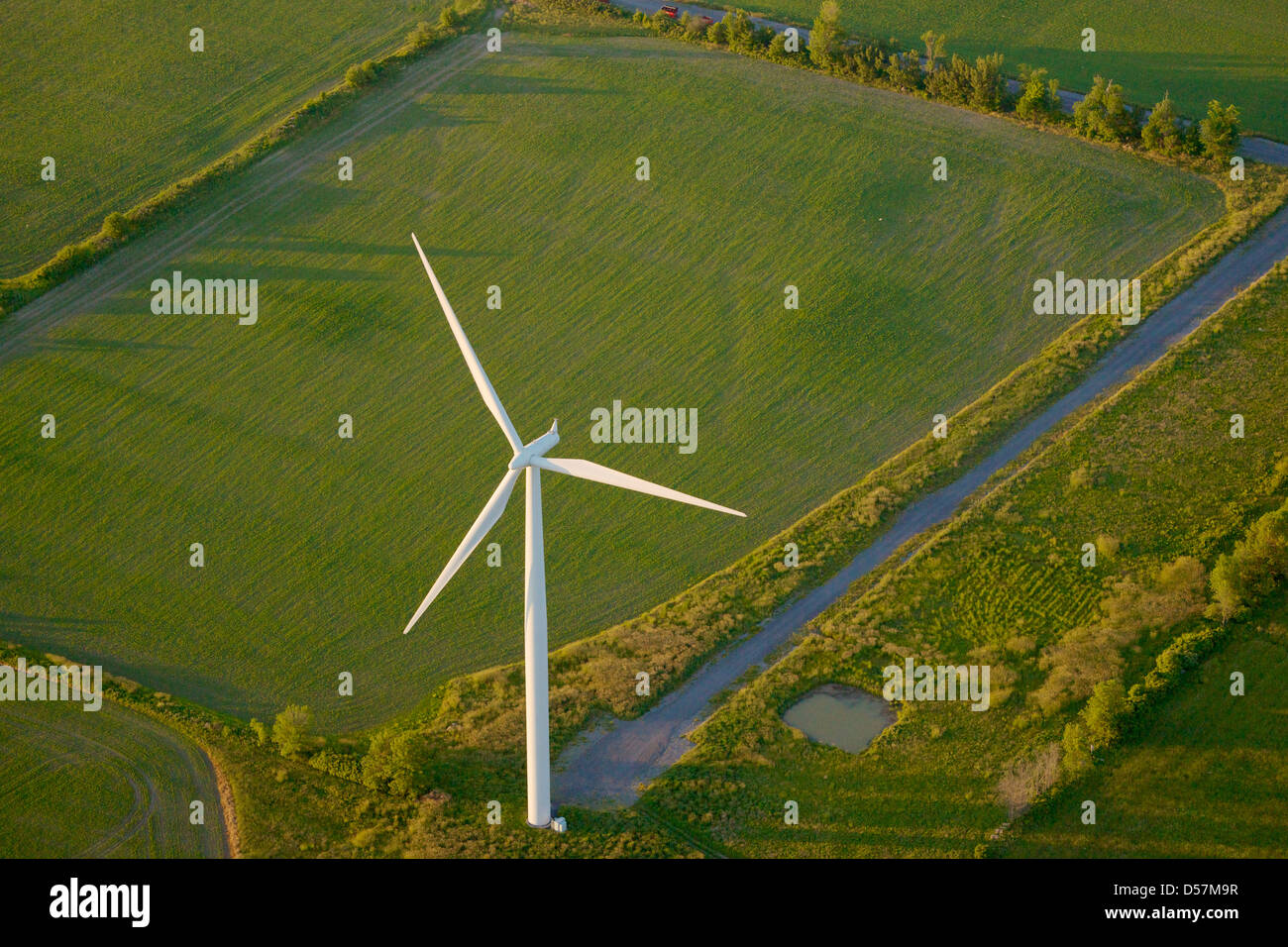 Aerial view of a Siemens Mark 11 wind turbine with access road on Wolfe Island, near Kingston Ontario, Canada.. Stock Photo