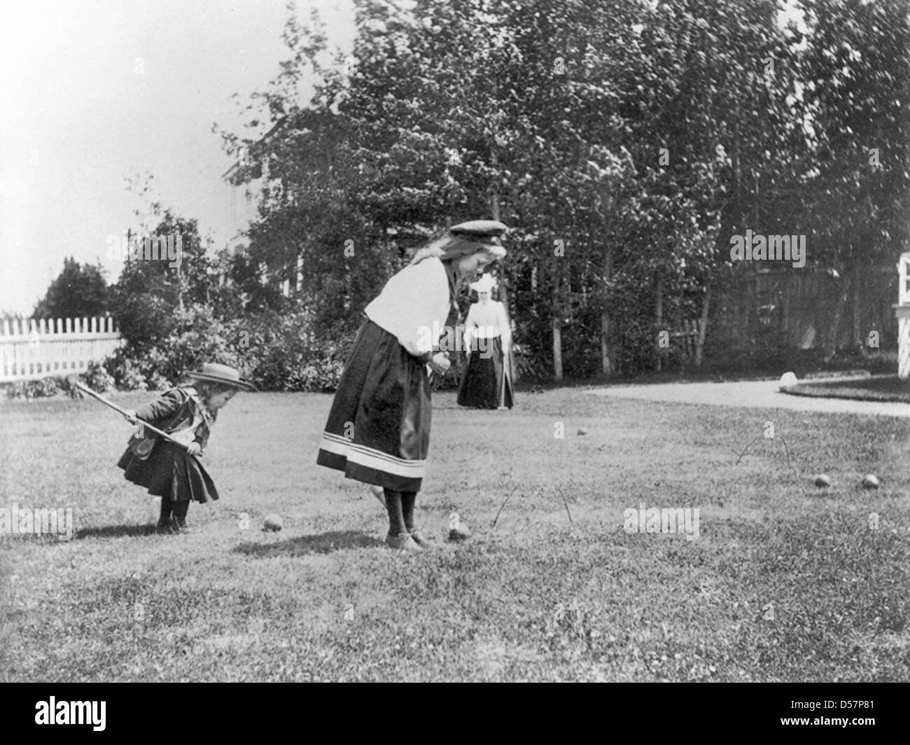 Two girls playing croquet, copied for G. Drinkwater in 1909 Stock Photo Alamy