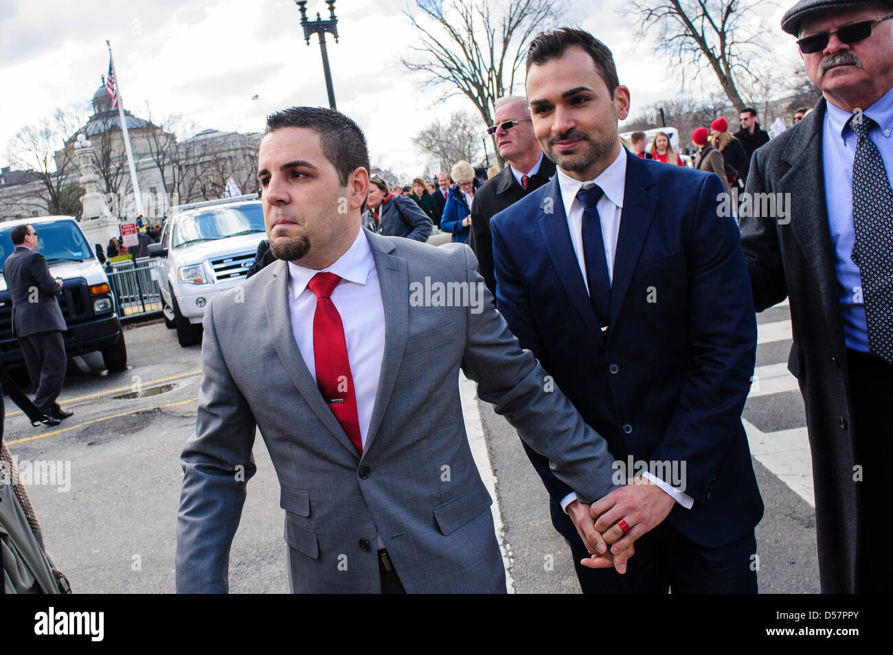 March 26, 2013 - Washington, District of Columbia, U.S. - Prop. 8 Plaintiffs Paul Katami (R) and Jeff Zarrillo leave the Supreme Court in Washington, D.C. after the Court heard arguments for the first time Tuesday on whether gays and lesbians have a constitutional right to marry in a California case that could affect the law nationwide. (Credit Image: © Pete Marovich/ZUMAPRESS.com) Stock Photo