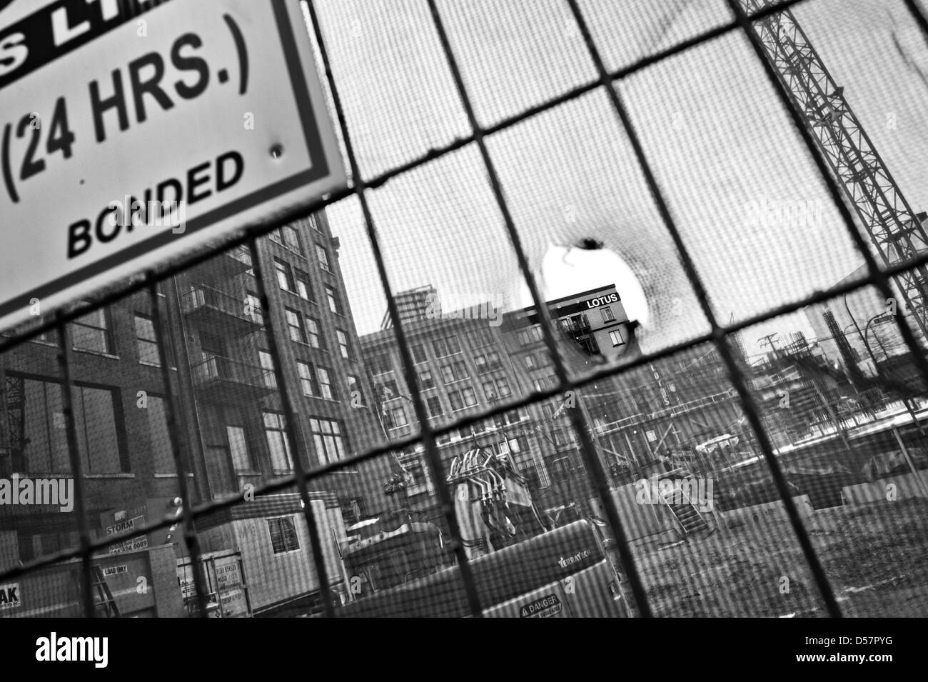 A hole on the safety nets and a sign in downtown of Vancouver BC Stock
