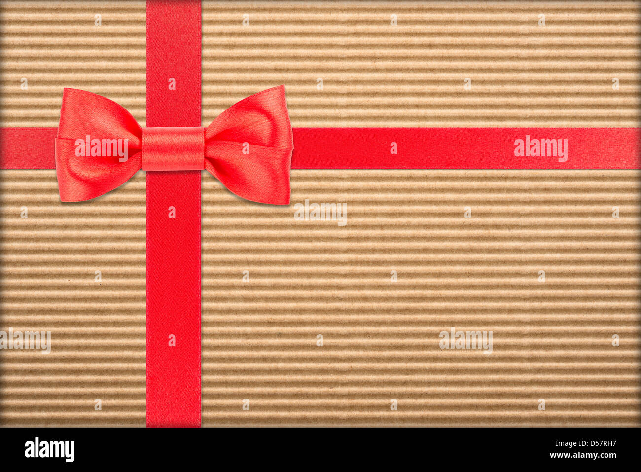 Red Wrapped Rippon red bow and ribbon over wrapped gift Stock Photo - Alamy