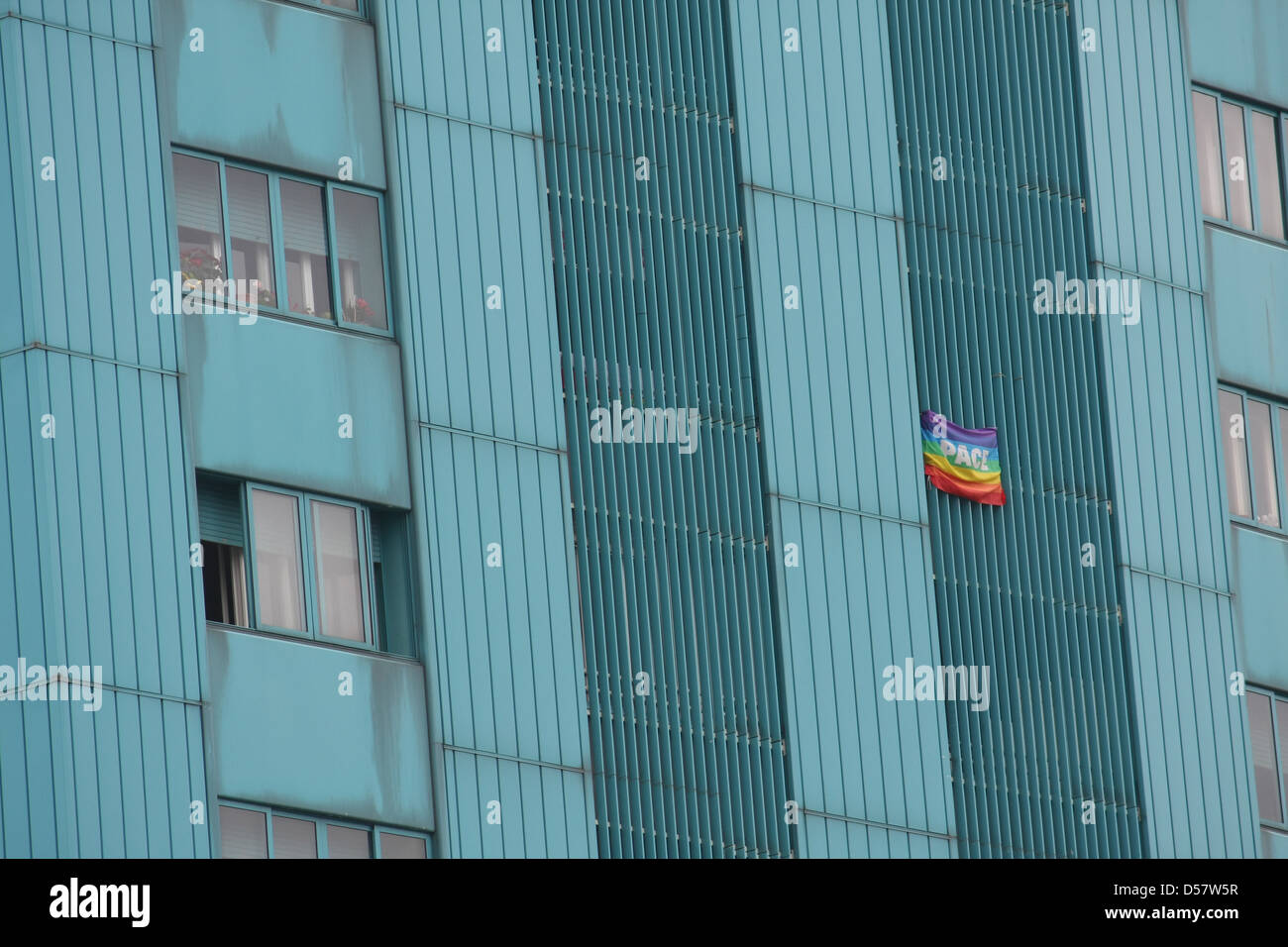 peace flag hung a huge condominium skyscraper in Italian metropolis Stock Photo
