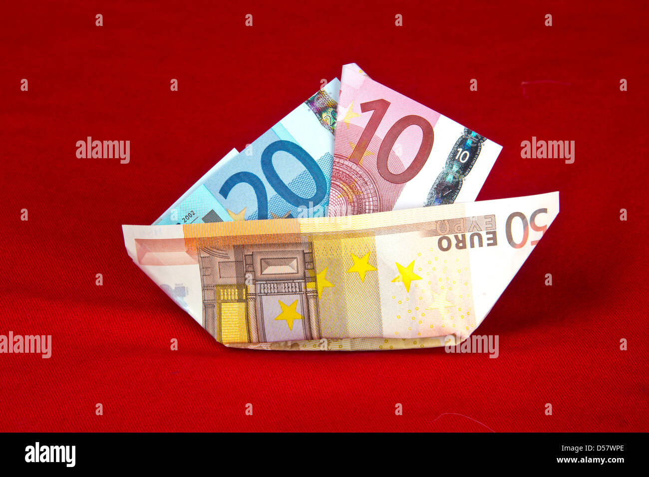 Euros bank notes. paper boat Money.Eurozone, European curency, Floating currency, paper money cash.  €5 €10 €20 €50 euros banknotes  135182 Euros Stock Photo