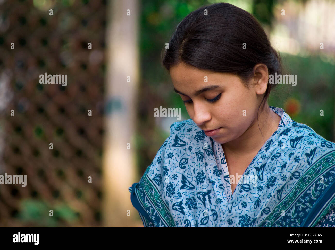 Young Girl Siting Alone Stock Photo