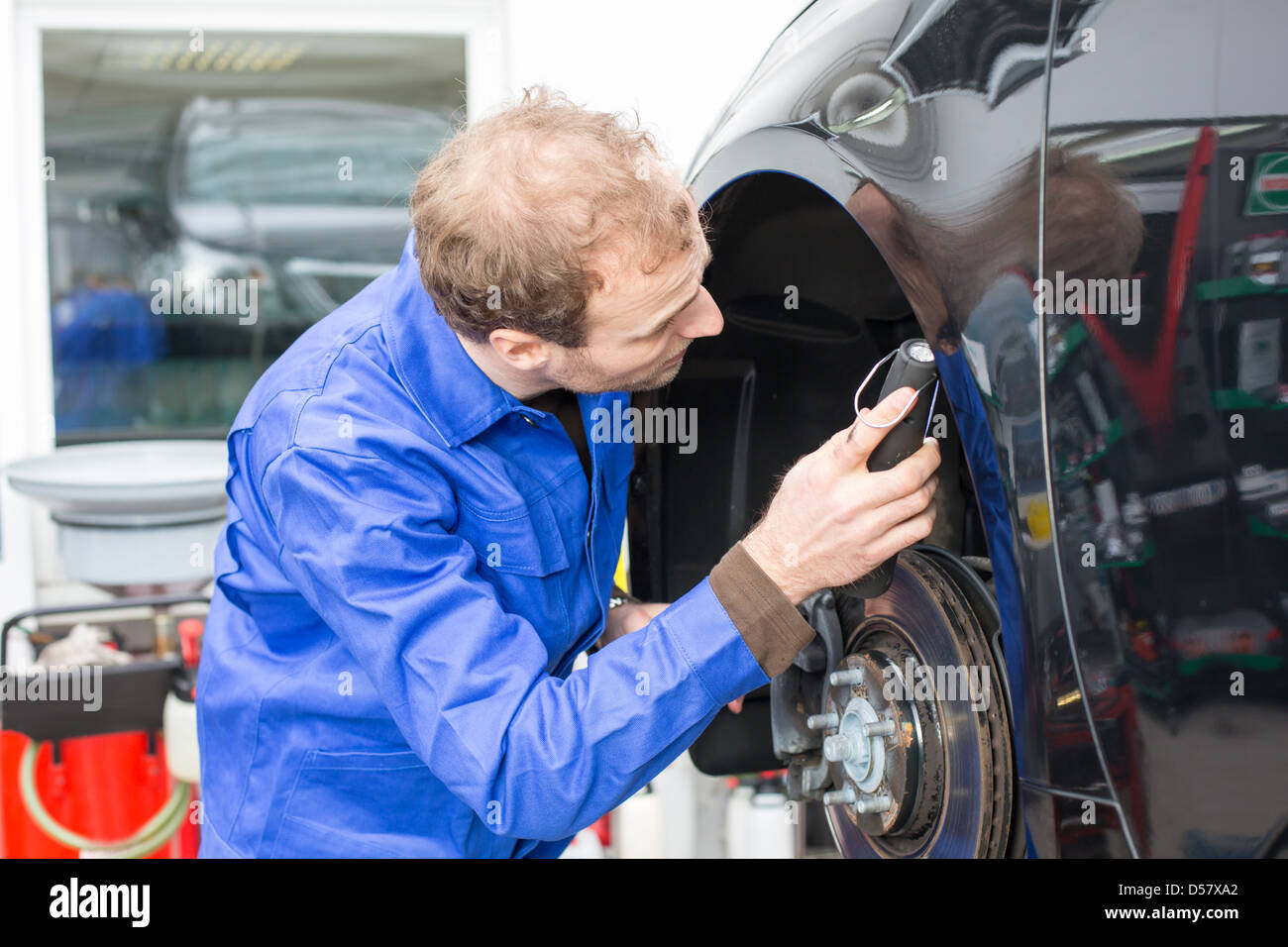 Garage with car repairs on a lift hi-res stock photography and images ...