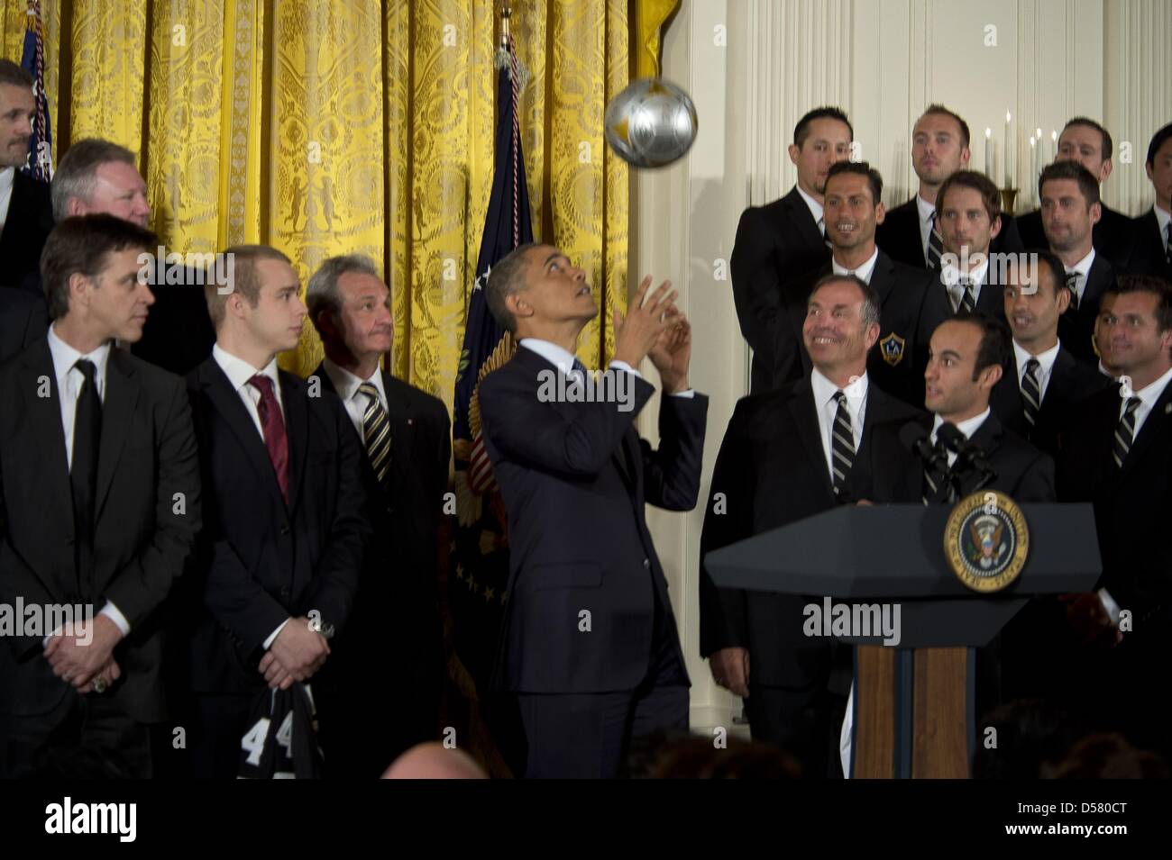 Washington, DC, USA. 26th March, 2013. The White House-Washington DC..President Barack Obama welcomes the Stanley Cup champion Los Angeles Kings and the Major League Soccer champion LA Galaxy to the White House to honor their 2012 championship seasons in a ceremony in the East Room.He accepts a soccer ball and jersey from the LA Galaxy team..photo:   - ImageCatcher News(Credit Image:  Credit:  Christy Bowe/Globe Photos/ZUMAPRESS.com/Alamy Live News) Stock Photo