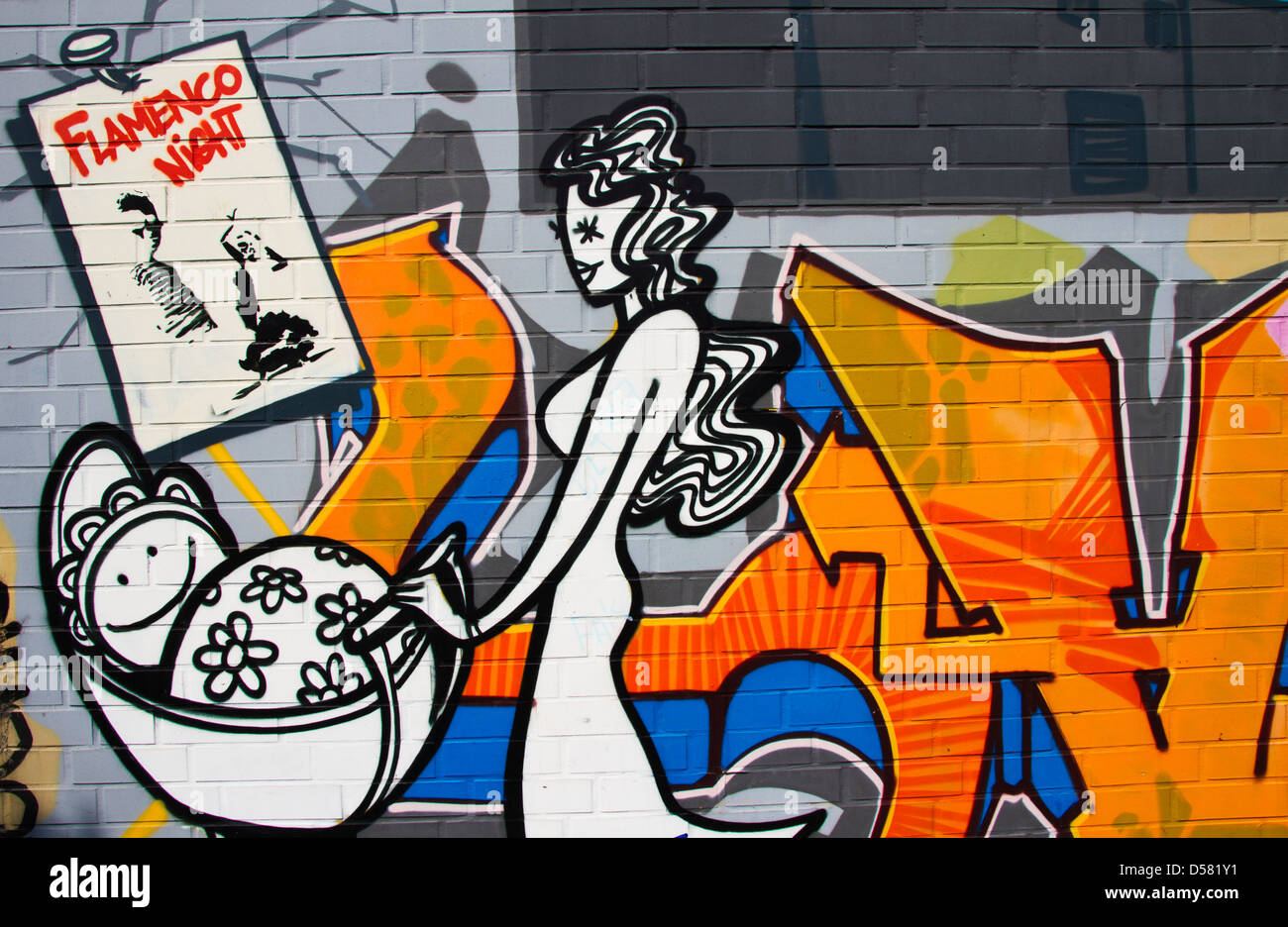 Graffiti of a woman with buggy as a main motive of the artwork Stock Photo
