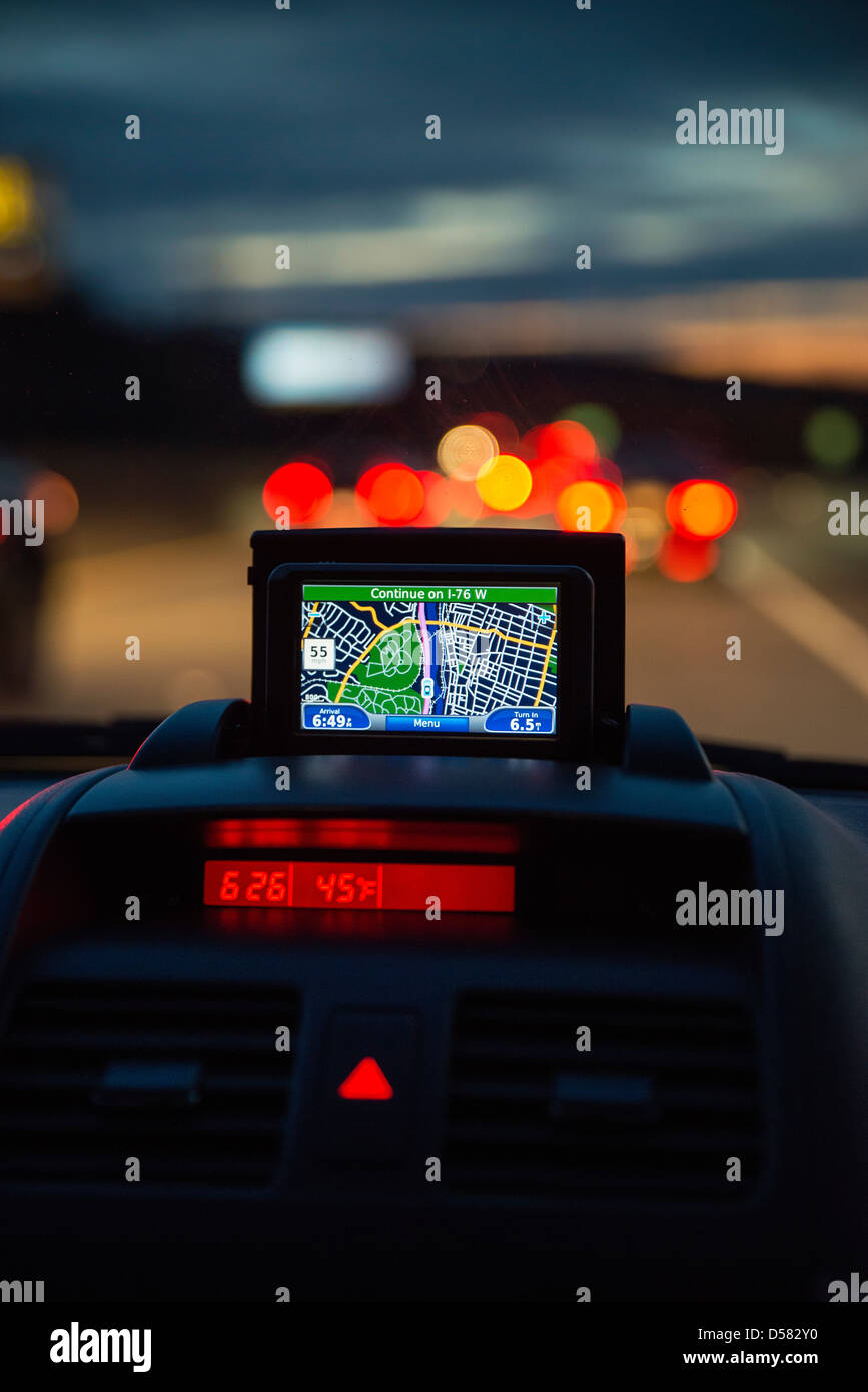 GPS unit in the window of a car in traffic. Stock Photo