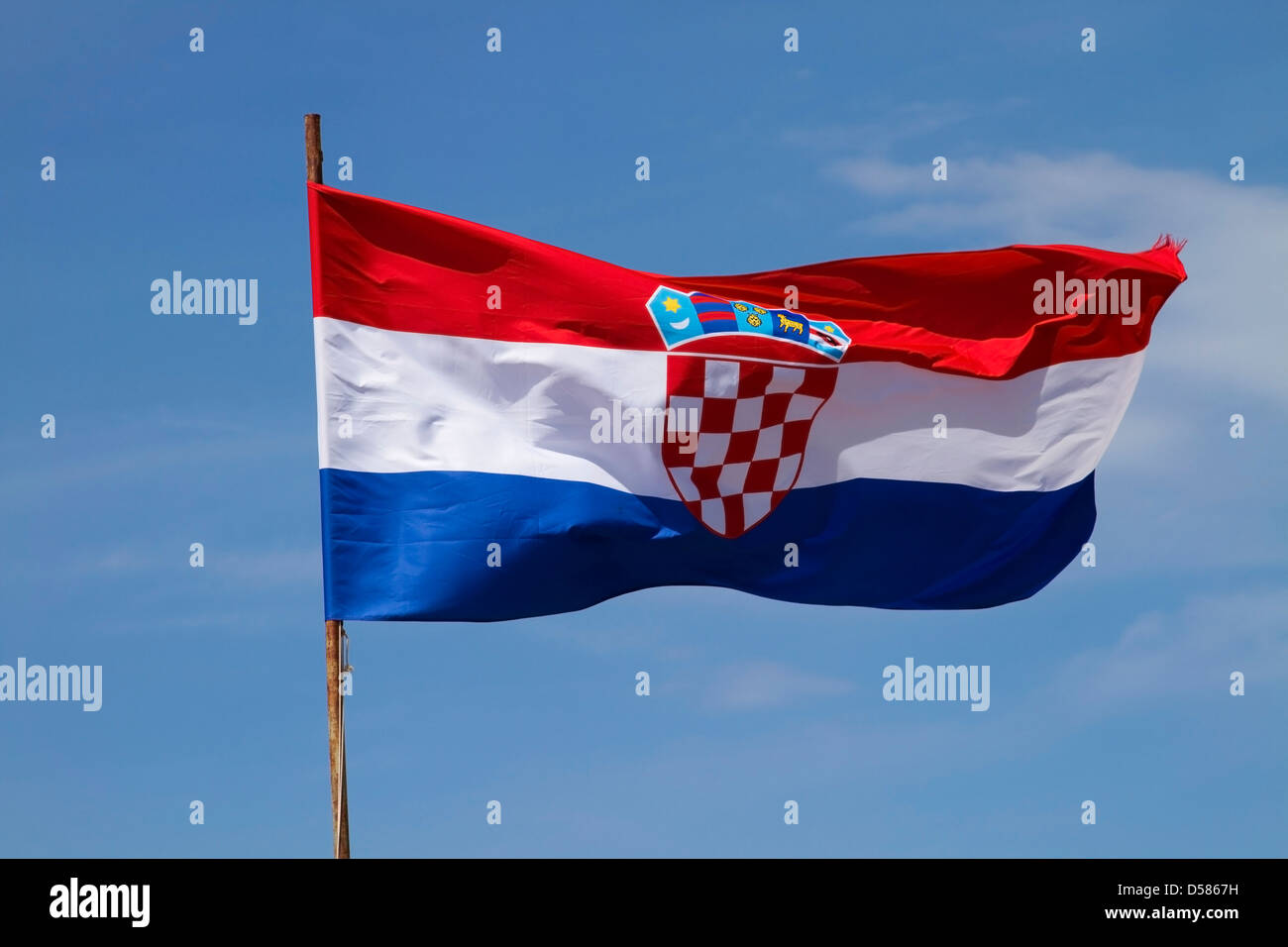The flag of Croatia flying above the walls of Dubrovnik old town Stock Photo