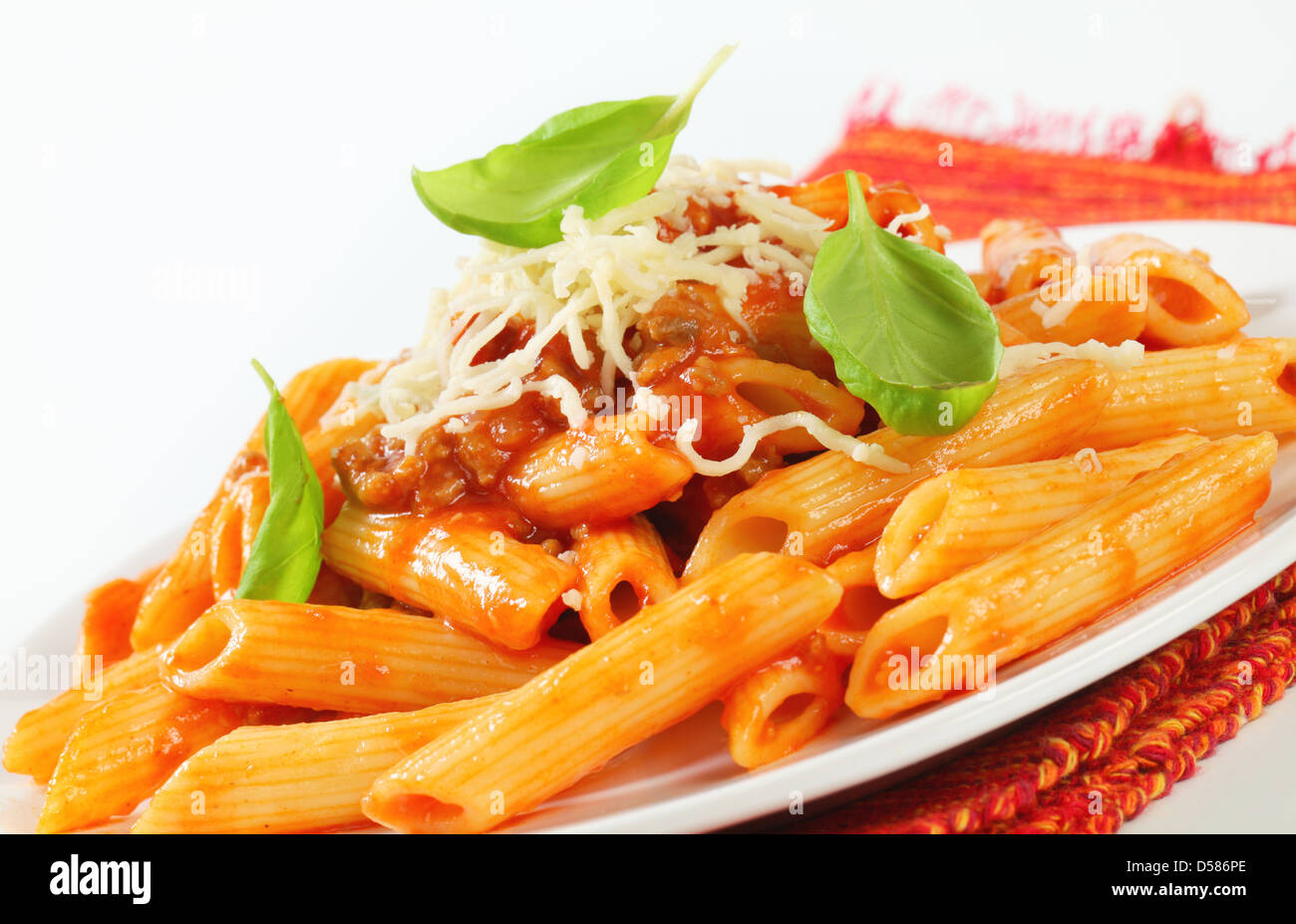 Penne pasta with meat-based tomato sauce and cheese Stock Photo - Alamy