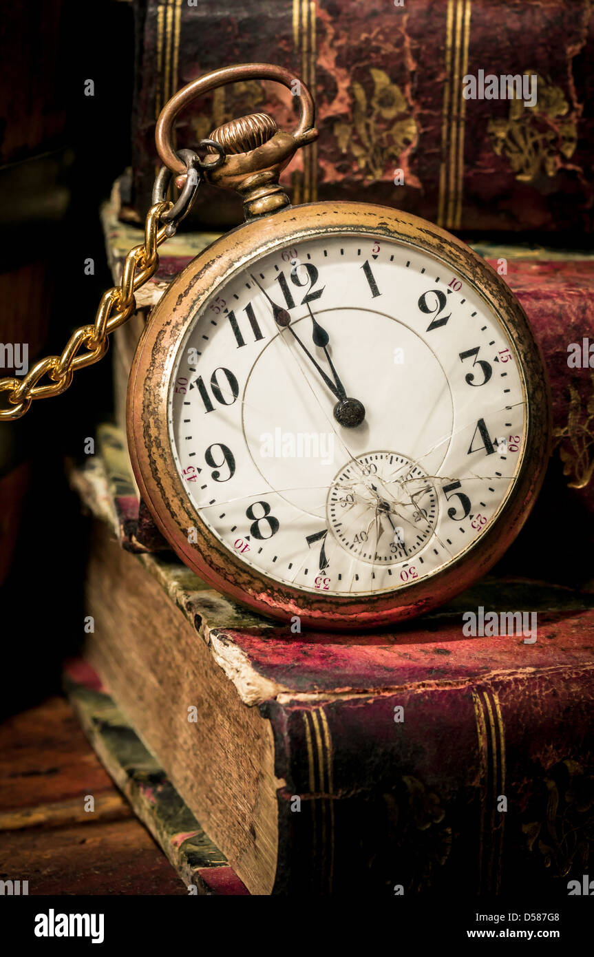 Old pocket watch and books in Lowkey Stock Photo Alamy