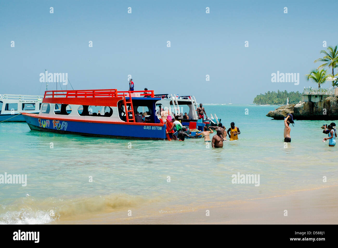 Tourists boarding a glass bottom boat Store Bay, Tobago Stock Photo - Alamy