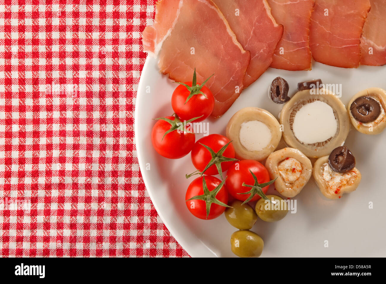 Cold appetizer, plate of assorted cold cuts traditional in mediterranean countries Stock Photo