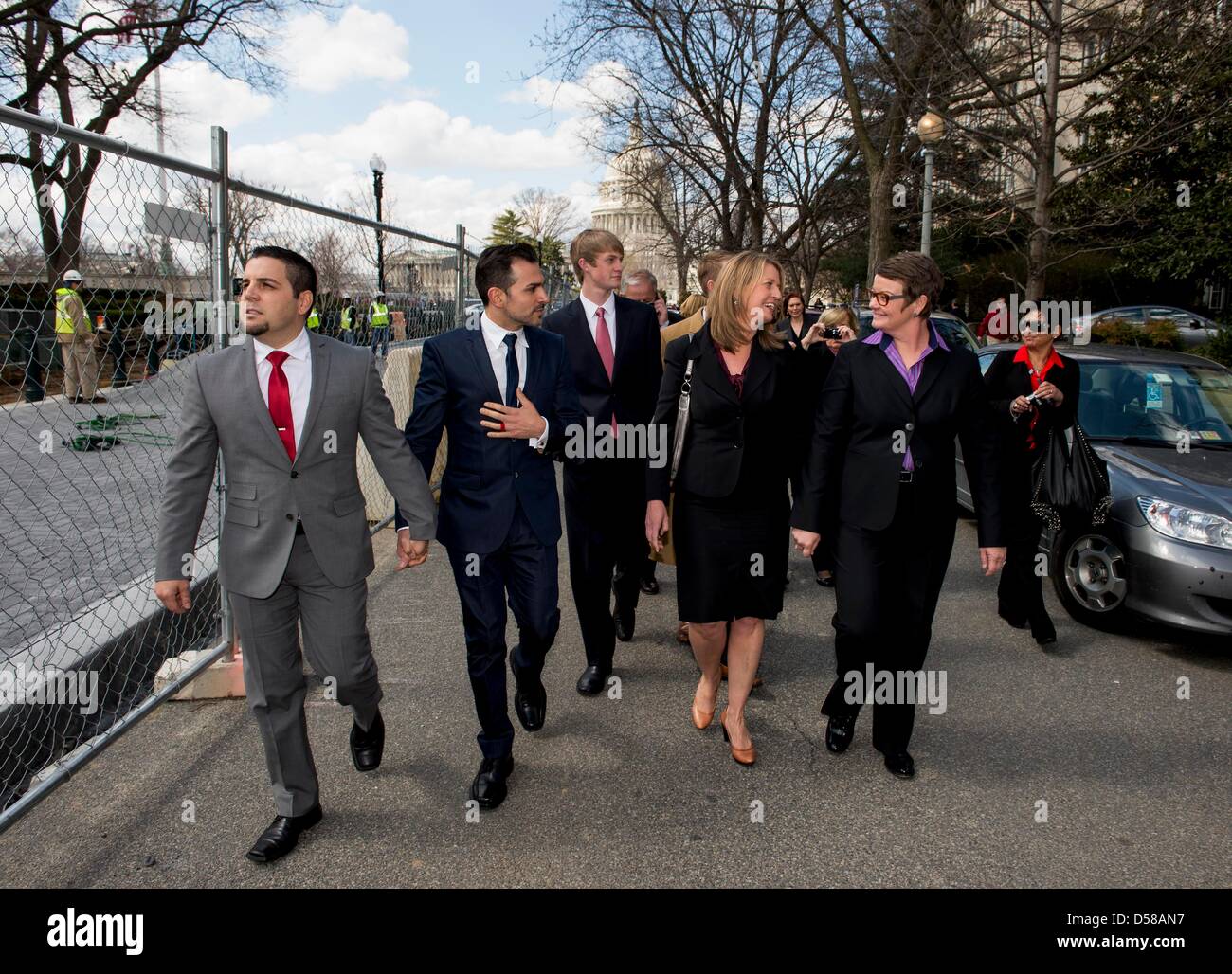March 26, 2013 - Washington, District of Columbia, U.S. - Prop 8 plaintiffs (from left) JEFF ZARRILLO, PAUL KATAMI, SANDY STIER and KRIS PERRY leave the U.S. Supreme Court after oral arguments in the landmark Proposition 8 marriage equality case.(Credit Image: © Brian Cahn/ZUMAPRESS.com) Stock Photo