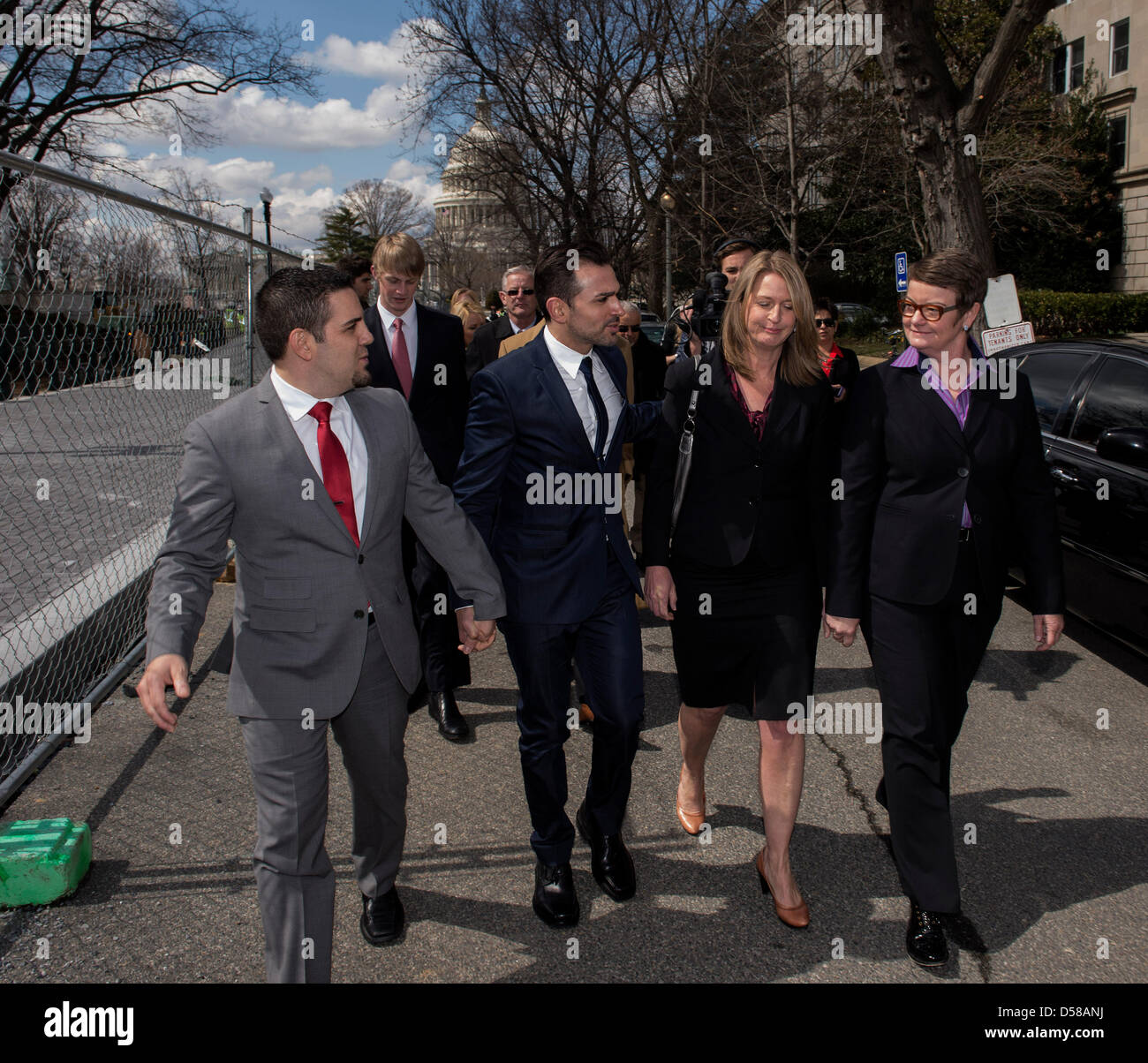 March 26, 2013 - Washington, District of Columbia, U.S. - Prop 8 plaintiffs (from left) JEFF ZARRILLO, PAUL KATAMI, SANDY STIER and KRIS PERRY leave the U.S. Supreme Court after oral arguments in the landmark Proposition 8 marriage equality case.(Credit Image: © Brian Cahn/ZUMAPRESS.com) Stock Photo