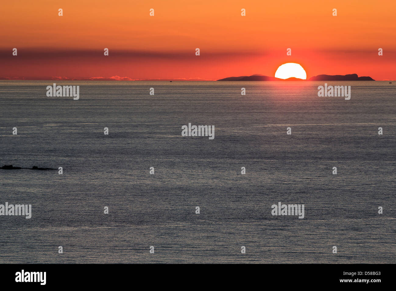 Setting sun over Summer isles at Achiltibuie in Scotland. Stock Photo