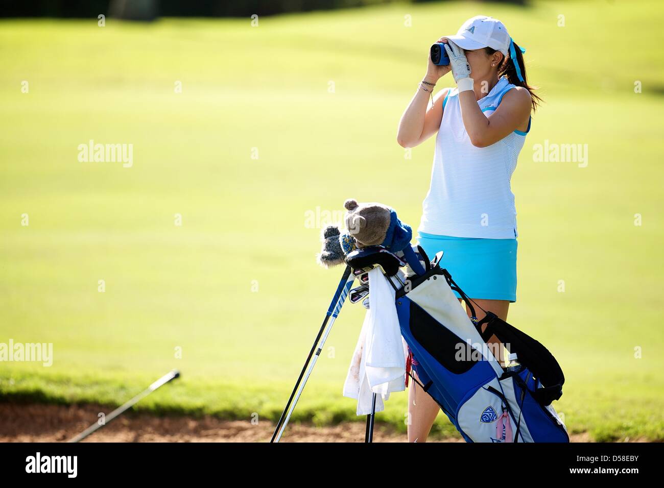 Kapalua, Hawaii, USA. 25th March 2013. Tiffany Lua of UCLA measures during the 2013 Anuenue Spring Break Classic hosted by University of Hawaii at the Kapalua Bay Course on the island of Maui. Credit: Cal Sport Media / Alamy Live News Stock Photo