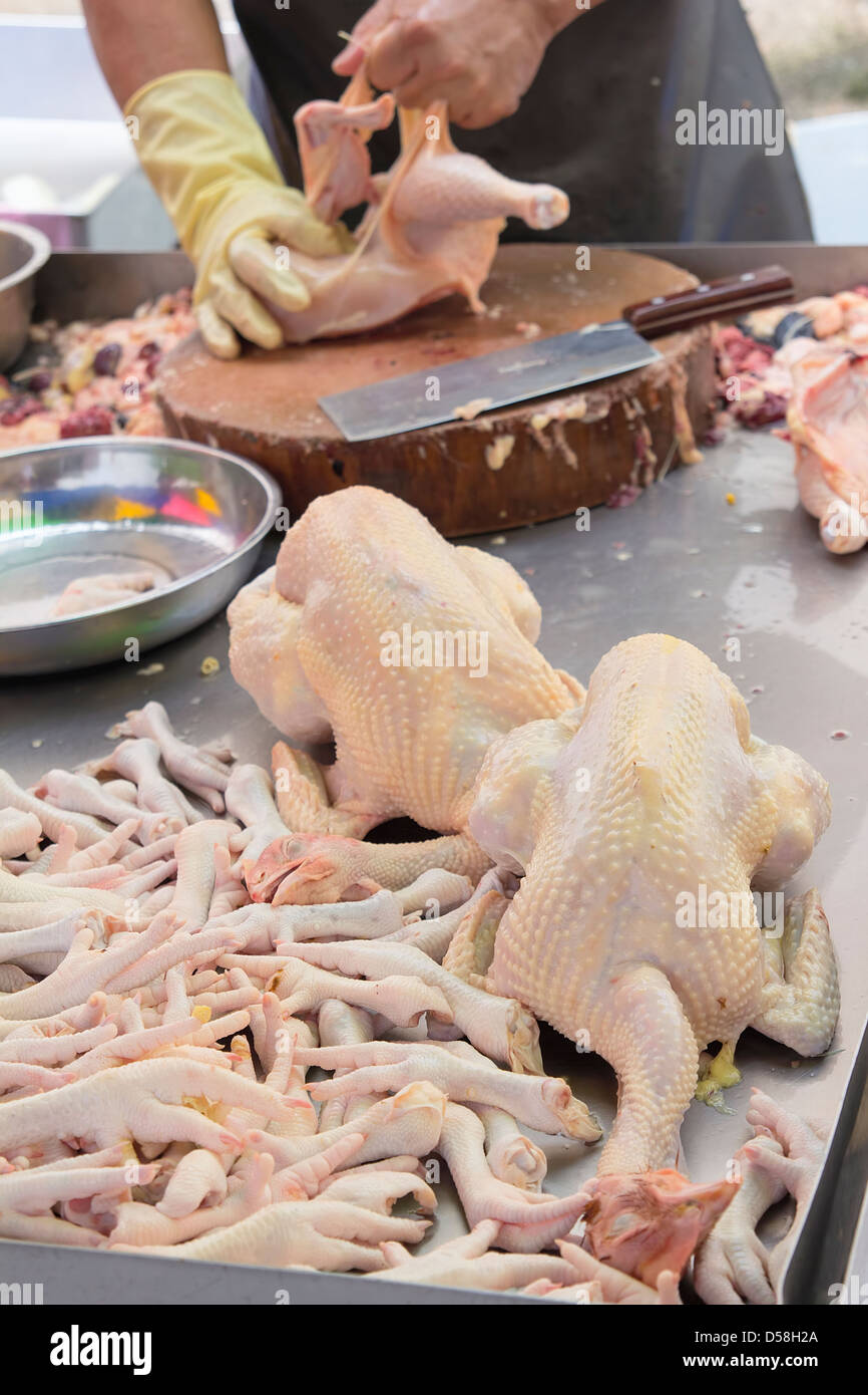 Chicken Butcher at Wet Market in Asia Stock Photo