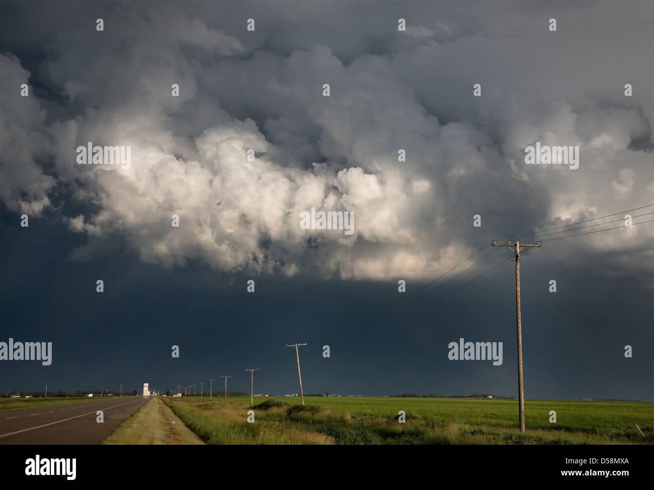 Storm Clouds Saskatchewan billowing clouds and gravel road Stock Photo ...