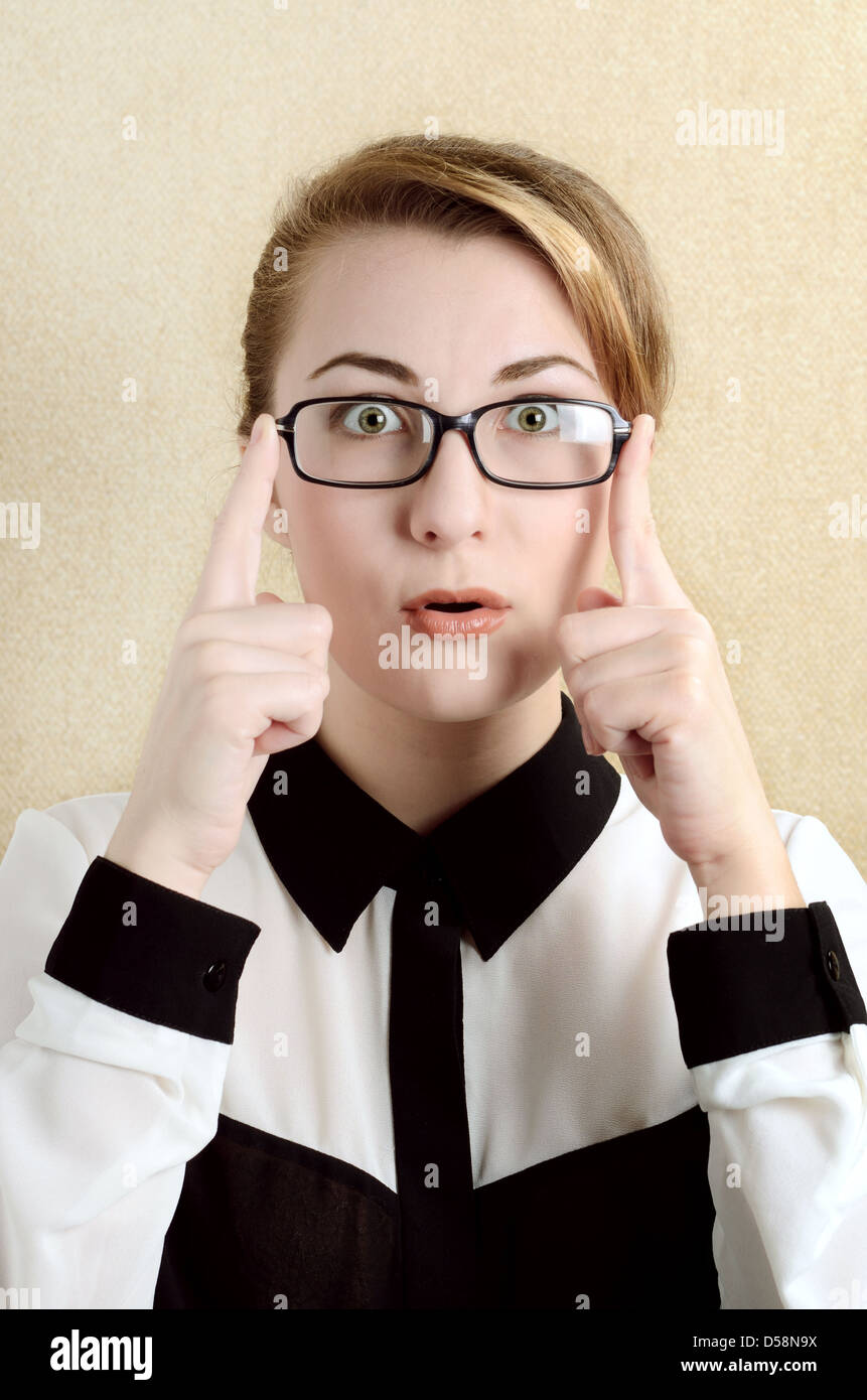 Portrait of a young surprised woman in glasses Stock Photo - Alamy
