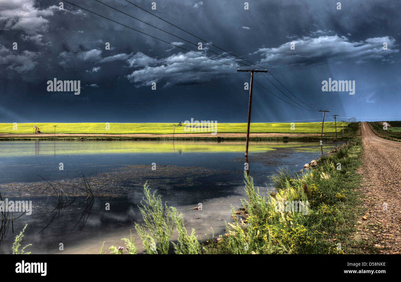 Storm Clouds Saskatchewan billowing clouds and gravel road Stock Photo ...
