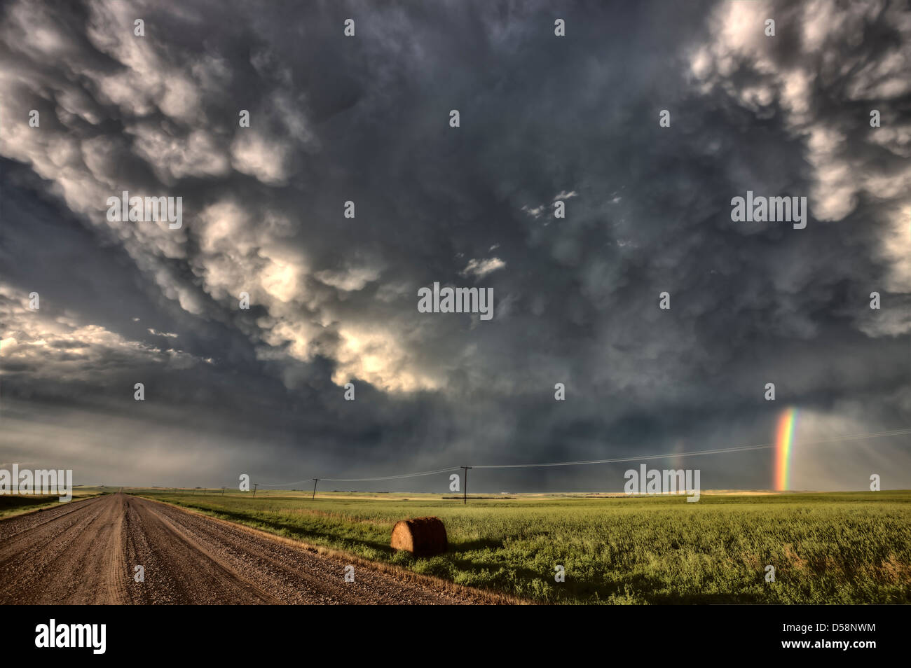 Storm Clouds Saskatchewan billowing clouds and gravel road Stock Photo ...