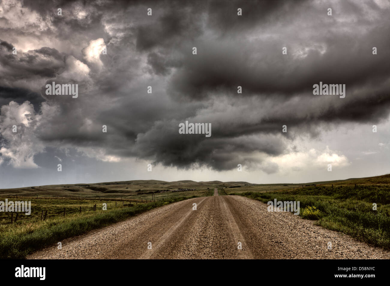 Storm Clouds Saskatchewan billowing clouds and gravel road Stock Photo ...