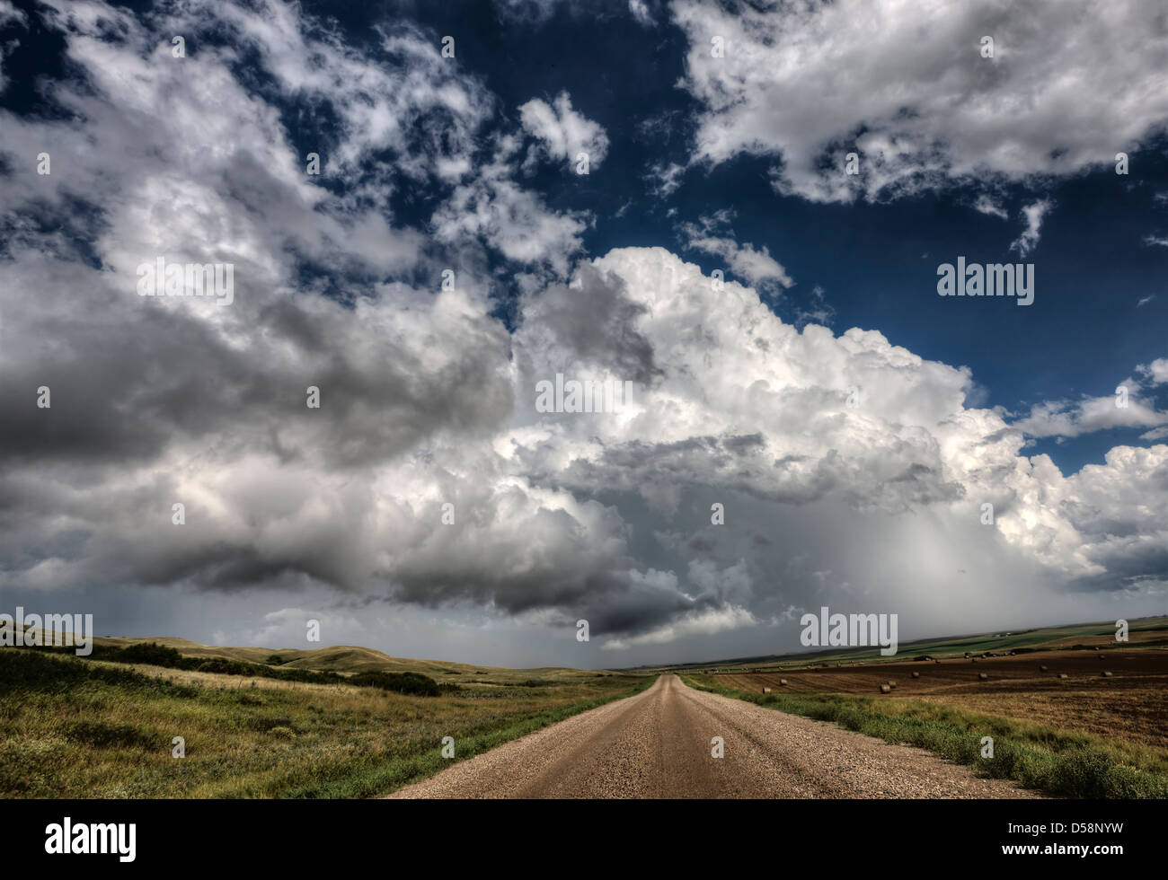Storm Clouds Saskatchewan billowing clouds and gravel road Stock Photo ...