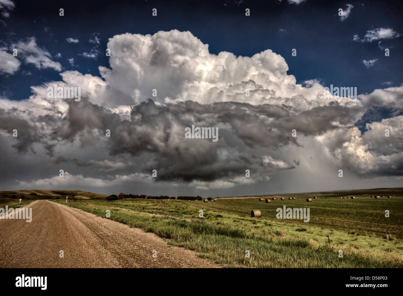 Storm Clouds Saskatchewan billowing clouds and gravel road Stock Photo ...