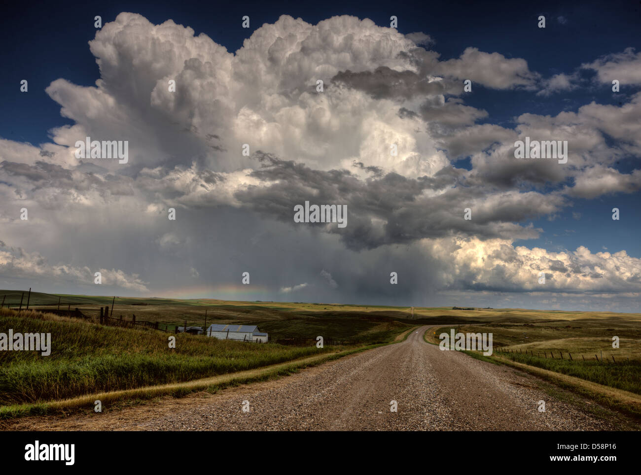 Storm Clouds Saskatchewan billowing clouds and gravel road Stock Photo ...