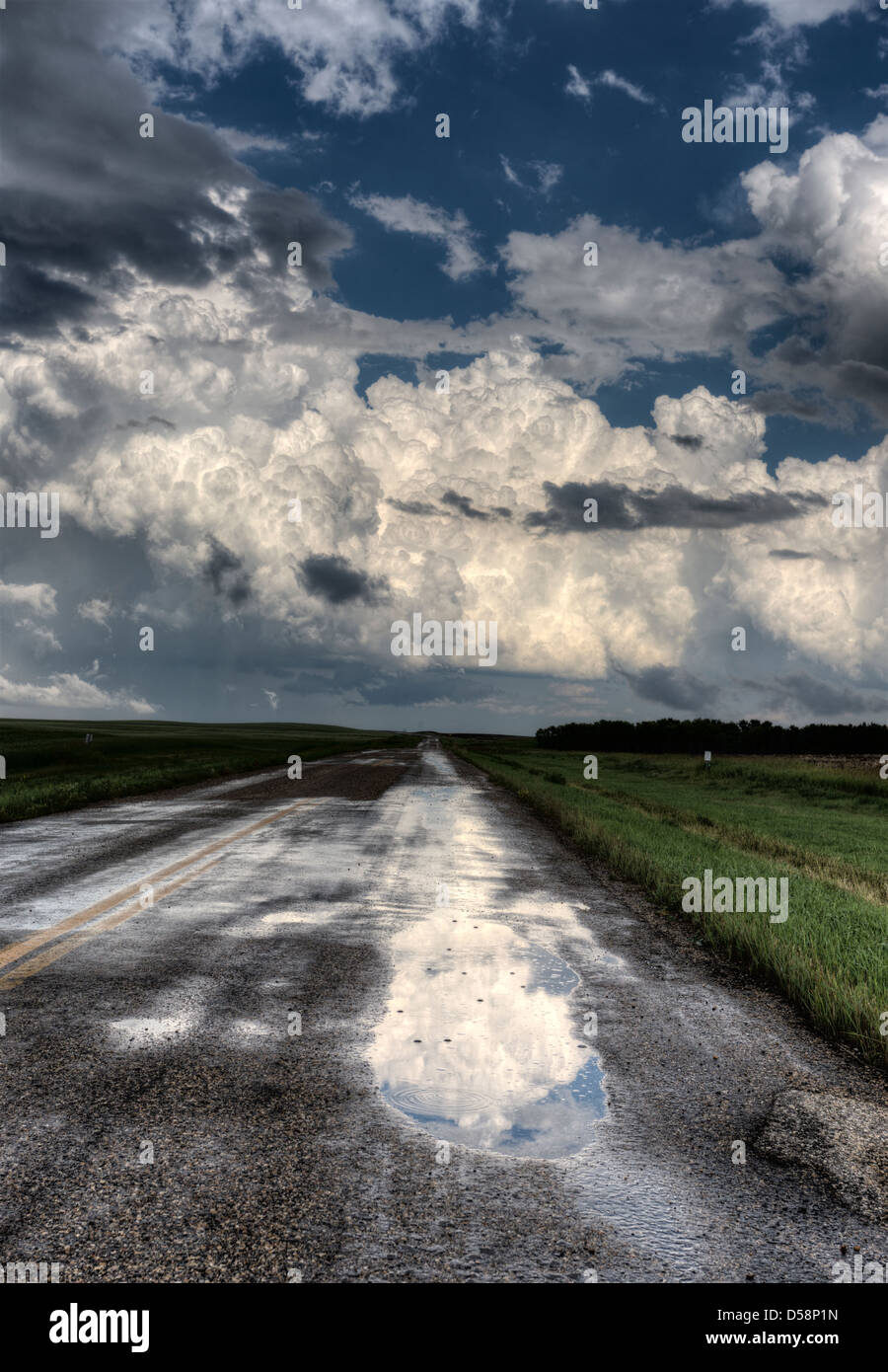 Storm Clouds Saskatchewan billowing clouds and gravel road Stock Photo ...