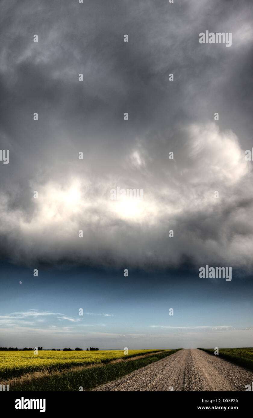 Storm Clouds Saskatchewan billowing clouds and gravel road Stock Photo ...