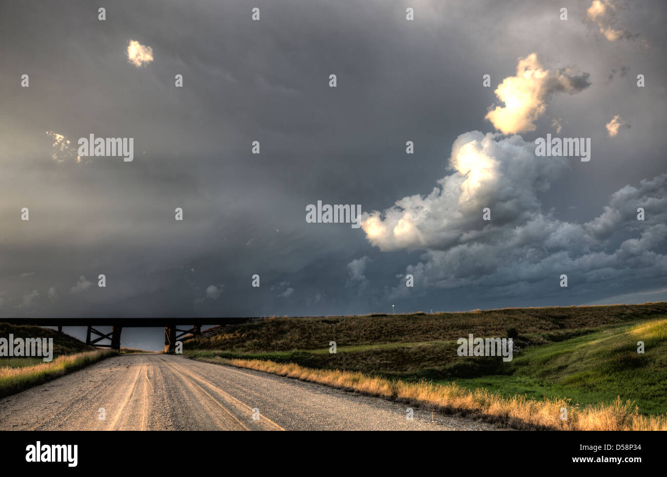 Storm Clouds Saskatchewan billowing clouds and gravel road Stock Photo ...