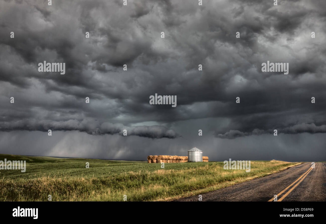 Storm Clouds Saskatchewan billowing clouds and paved road Stock Photo ...