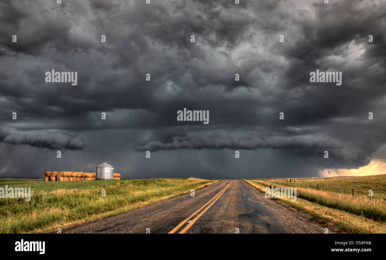 Storm Clouds Saskatchewan billowing clouds and paved road Stock Photo ...