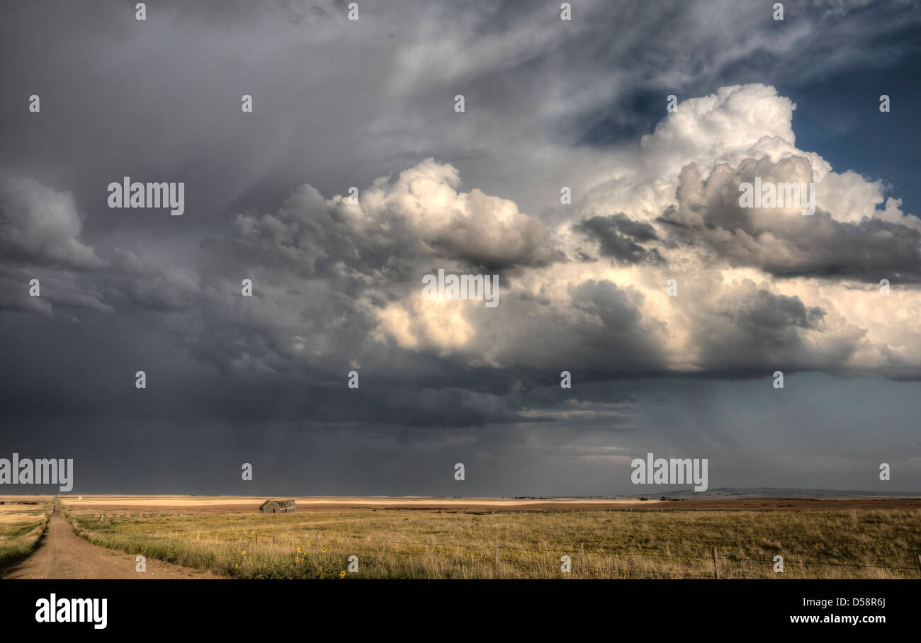 Storm Clouds Saskatchewan billowing clouds and gravel road Stock Photo ...