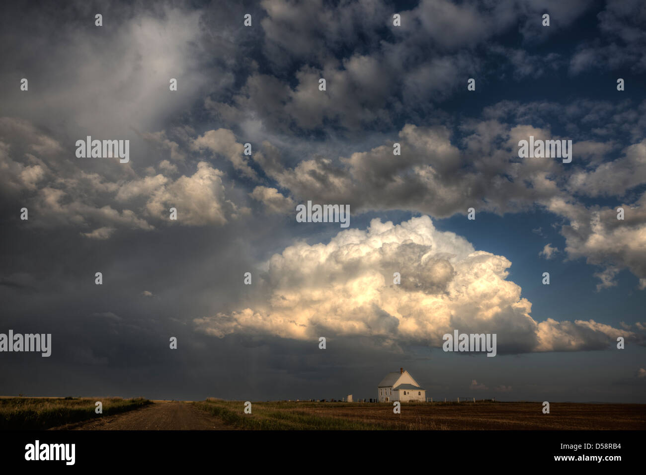 Storm Clouds Saskatchewan with country church at sunset Stock Photo - Alamy