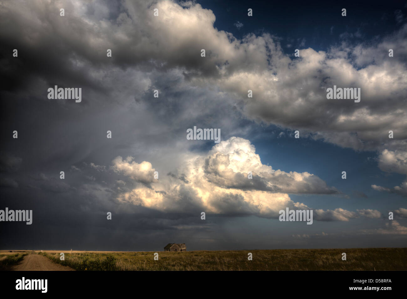 Storm Clouds Saskatchewan billowing clouds and gravel road Stock Photo ...