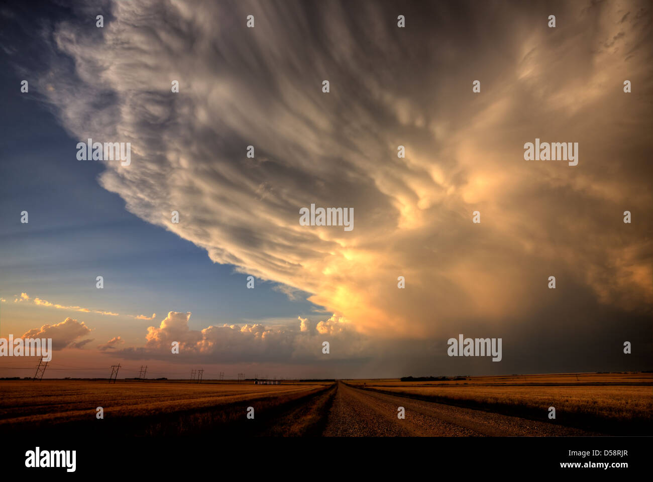 Storm Clouds Saskatchewan billowing clouds and gravel road Stock Photo ...