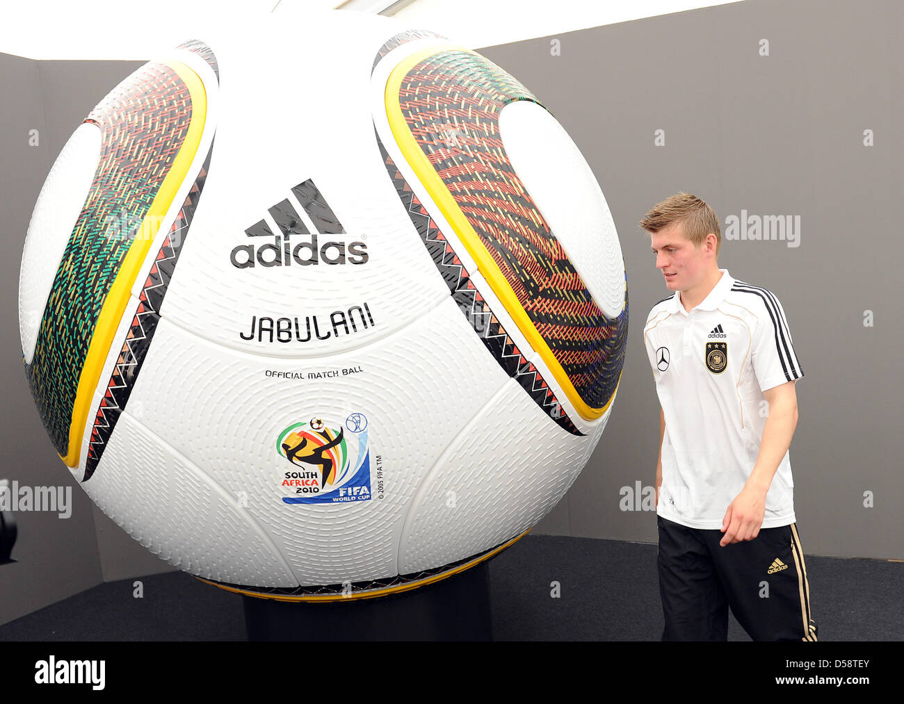 German international Toni Kroos passes a huge World Cup ball after a press conference of the German Football Association (DFB) in Eppan, Italy, 23 May 2010. The German national team prepares for the upcoming FIFA World Cup 2010 in South Africa in a training camp in Eppan, South Tirol until 02 June 2010. Photo: BERND WEISSBROD Stock Photo