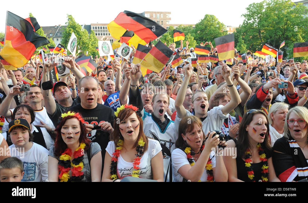 German ice hockey fans celebrate their team outside Lanxess Arena in
