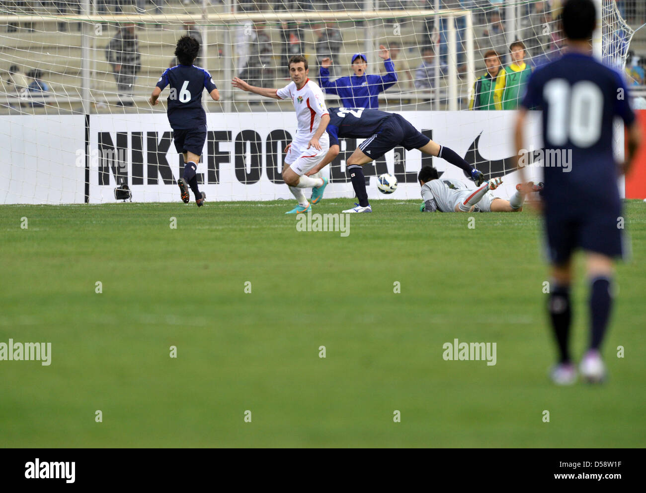 Amman, Jordan. 26th March 2013. Ahmad Hayel (JOR), MARCH 26, 2013 - Football / Soccer : Ahmad Hayel of Jordan celebrates after scoring his team's second goal past Maya Yoshida and goalkeeper Eiji Kawashima of Japan during the 2014 FIFA World Cup Asian Qualifiers Final Round Group B match between Jordan 2-1 Japan at King Abdullah International Stadium in Amman, Jordan. (Photo by Jinten Sawada/AFLO/Alamy Live News) Stock Photo