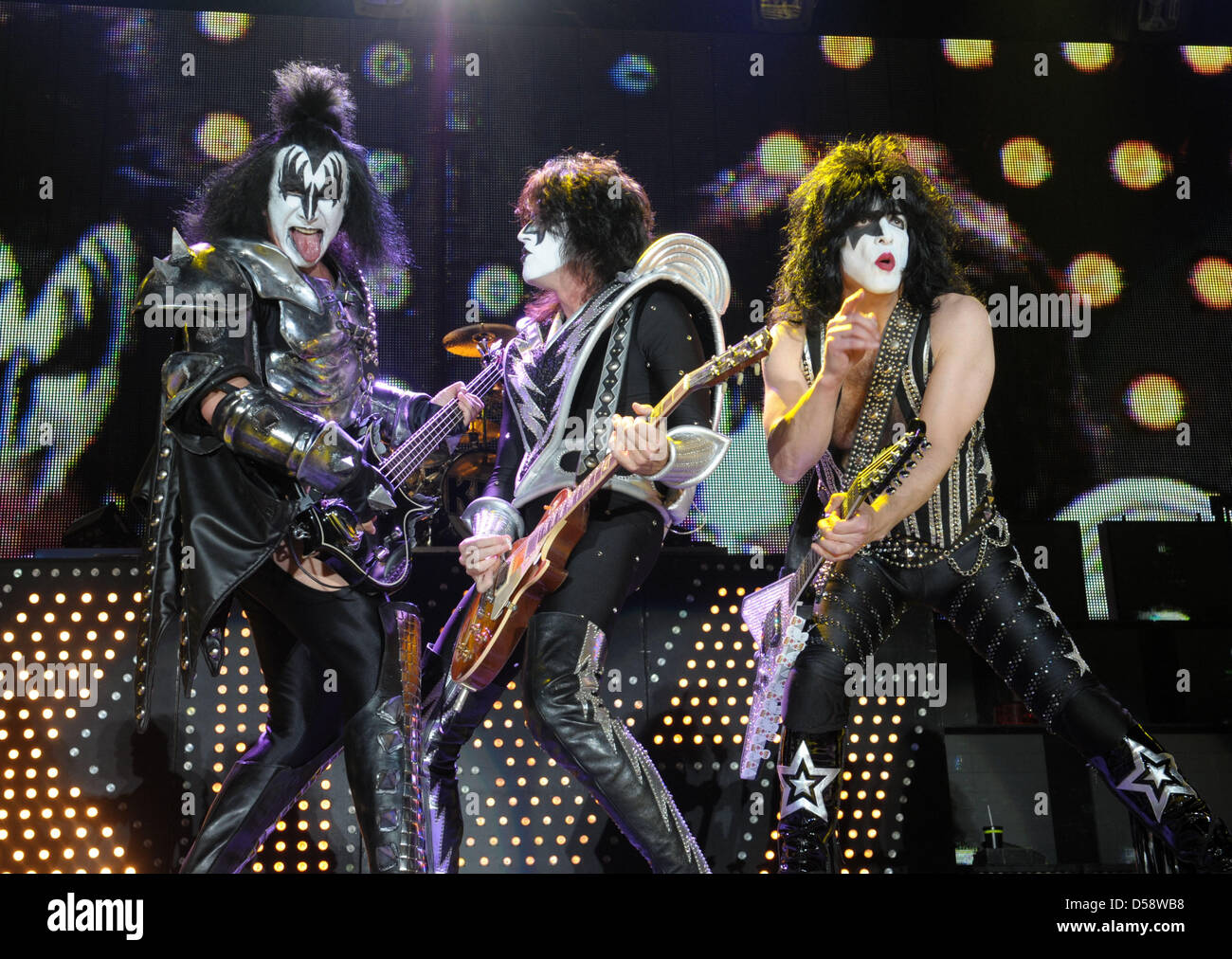 Musicians Gene Simmons (L-R), Tommy Thayer and Paul Stanley of US hard rock band Kiss perform during a concert at Arena Leipzig in Leipzig, Germany, 25 May 2010. The concert is the first of four concerts in Germany of the 'Sonic Boom over Europe Tour' during which Kiss presents their 19th studio album and older hits. Photo: Peter Endig Stock Photo