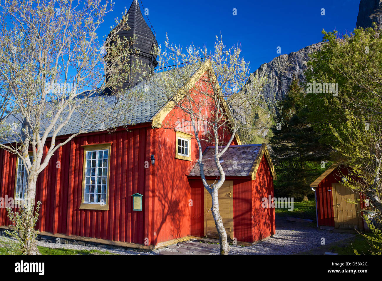Red old wooden church on Vaeroy, Lofoten islands in Norway Stock Photo