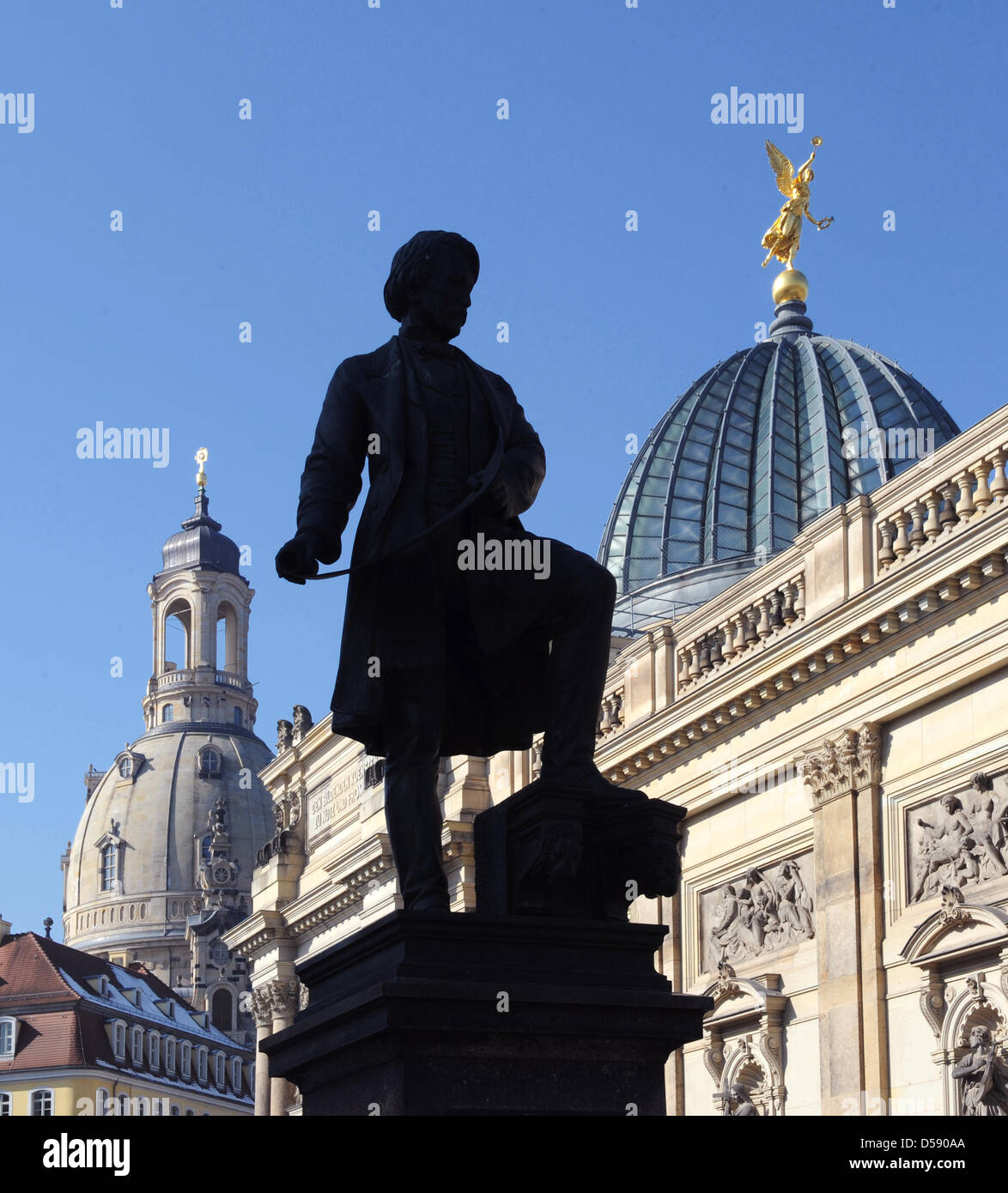 The Gottfried Semper memorial from 1892 stands in front of the Frauenkirche (L) and the art college in Dresden, Germany, 10 March 2010. Architect Semper (1803-1879) constructed the Semperoper, his most significant work. Photo: Matthias Hiekel Stock Photo