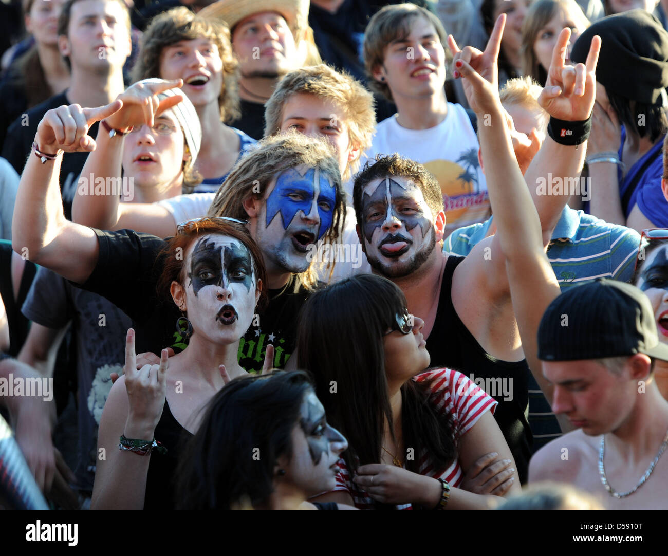 Fans of the rock band 'Kiss' cheer during the rock music festival 'Rock ...