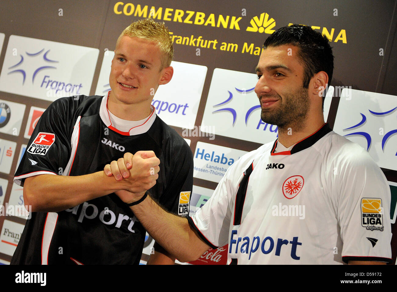 Sebastian Rode (L) and Georgios Tzavellas (R) pose during a press conference at Commerzbank Arena stadium in Frankfurt Main, Germany, 04 June 2010. Gterman Bundesliga club Eintracht Frankfurt signed Tzavellas of Panionios Athens and Rode of Kickers Offenbach and, thus, has almost finished the planning of its new squad for the next Bundesliga season. Photo: MARIUS BECKER Stock Photo